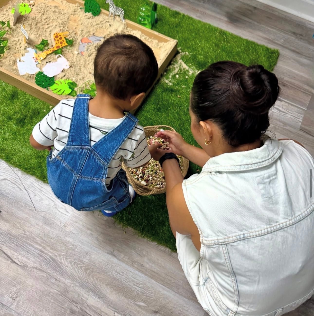 Ice painting with colorful paint and brushes at Sincerely Sensory